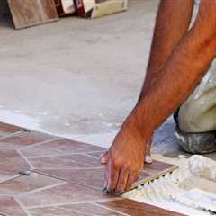 What is the first step in installing tile flooring?