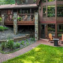 Preserving Beauty And Value: The Importance Of Exterior Painting For Log Home Builders In Eau..